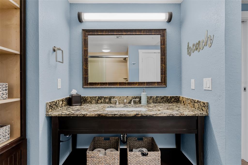 399 2nd Street, Unit 215 Indian Rocks Beach, FL 33785 - Photo 22 of 51 a bathroom with a sink and a mirror
