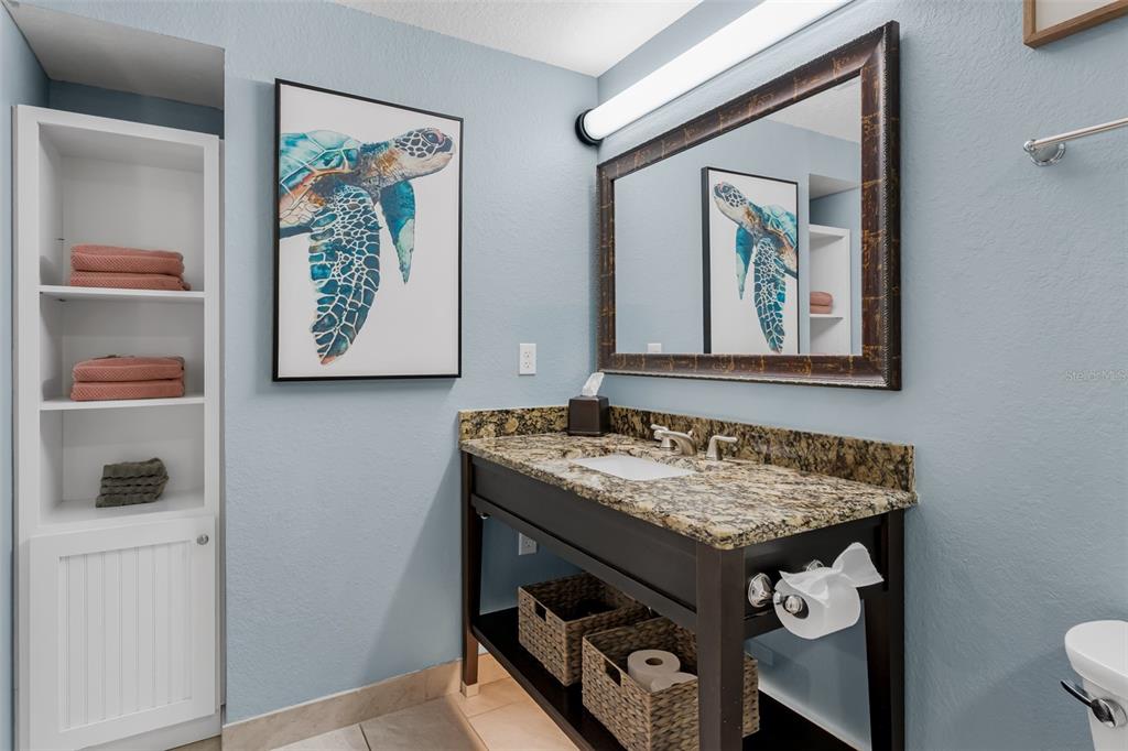 399 2nd Street, Unit 215 Indian Rocks Beach, FL 33785 - Photo 28 of 51 a bathroom with a sink and a mirror
