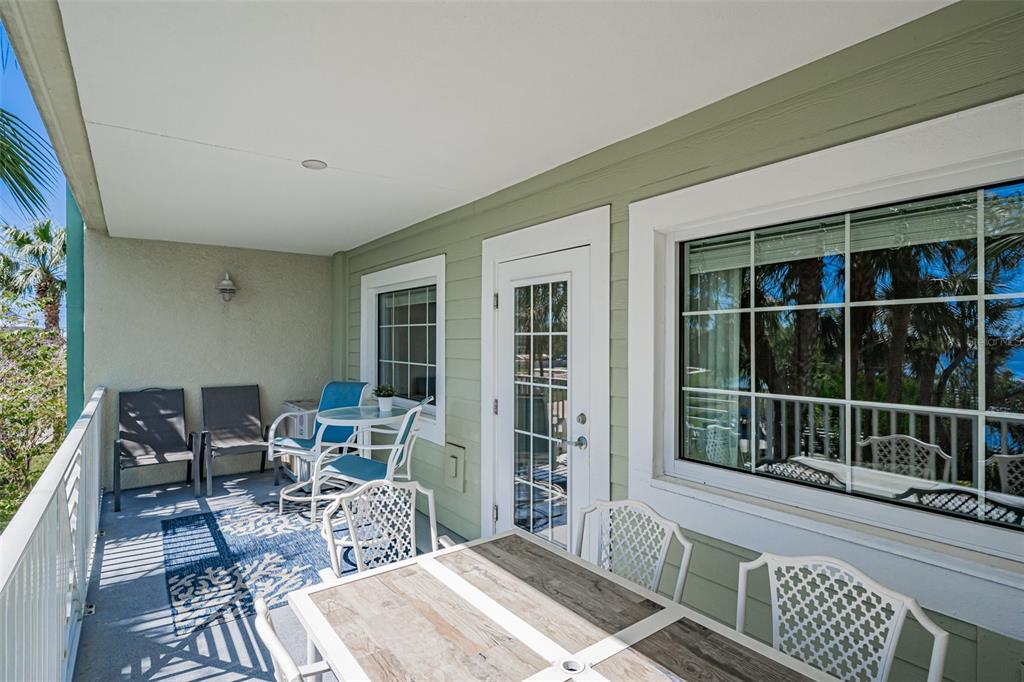399 2nd Street, Unit 215 Indian Rocks Beach, FL 33785 - Photo 30 of 51 a outdoor living space with furniture