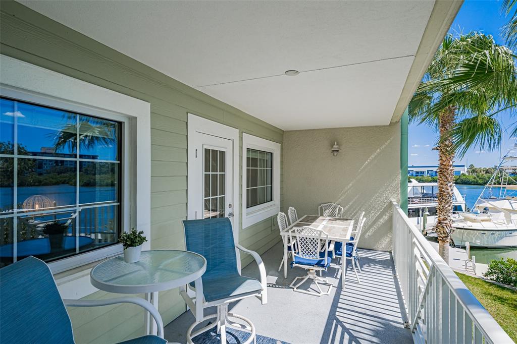399 2nd Street, Unit 215 Indian Rocks Beach, FL 33785 - Photo 31 of 51 a living room with furniture and a potted plant