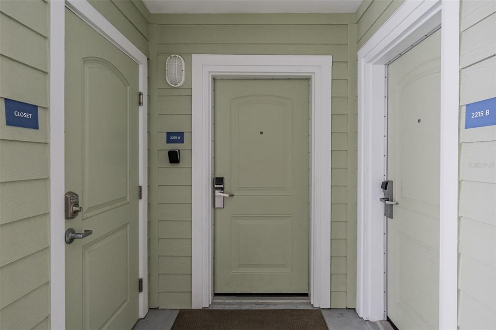 399 2nd Street, Unit 215 Indian Rocks Beach, FL 33785 - Photo 32 of 51 a view of a bathroom with a glass door