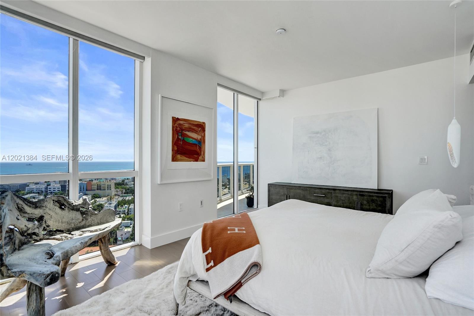 400 Alton Road, Unit PH11 Miami Beach, FL 33139 - Photo 5 of 49 a bedroom with a bed and large windows