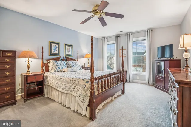 a bed room with a bed and a chandelier