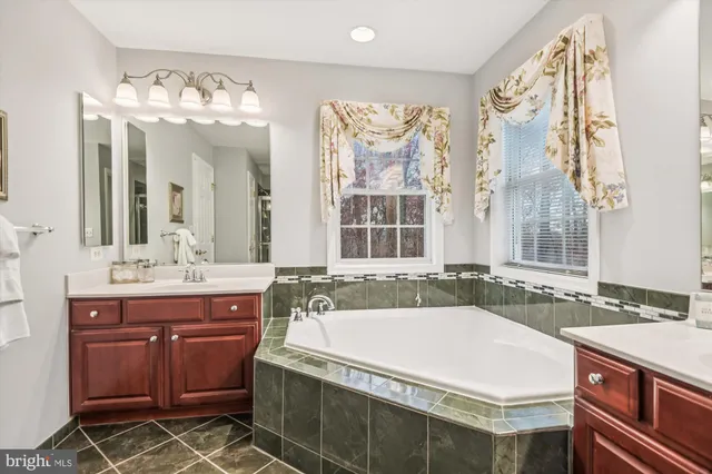 a bathroom with a sink a vanity and a mirror