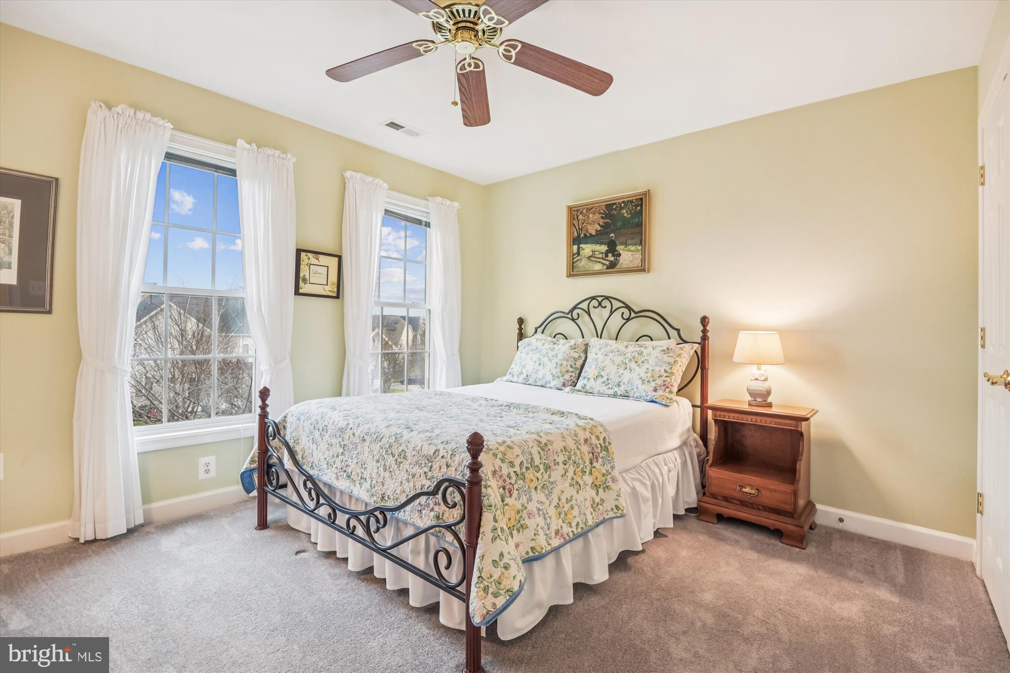 1584 Star Stella Drive Odenton, MD 21113 - Photo 30 of 45 a bedroom with a bed and a chandelier