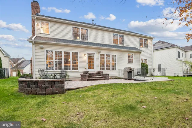 a view of staircase with wooden floor and white walls