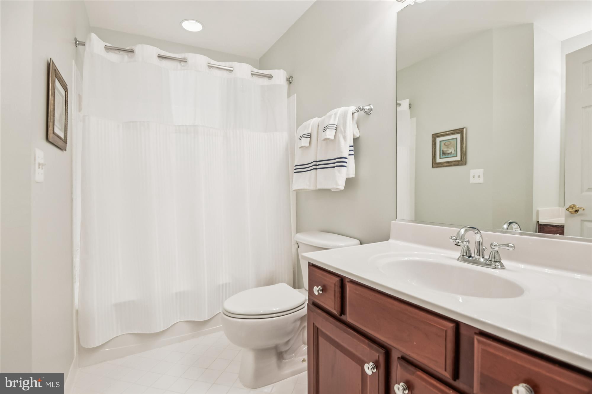 1584 Star Stella Drive Odenton, MD 21113 - Photo 31 of 45 a bathroom with a sink a toilet and shower curtain