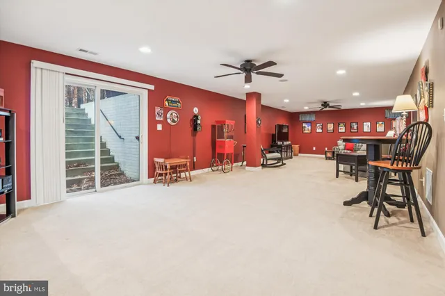 a living room with furniture and white walls