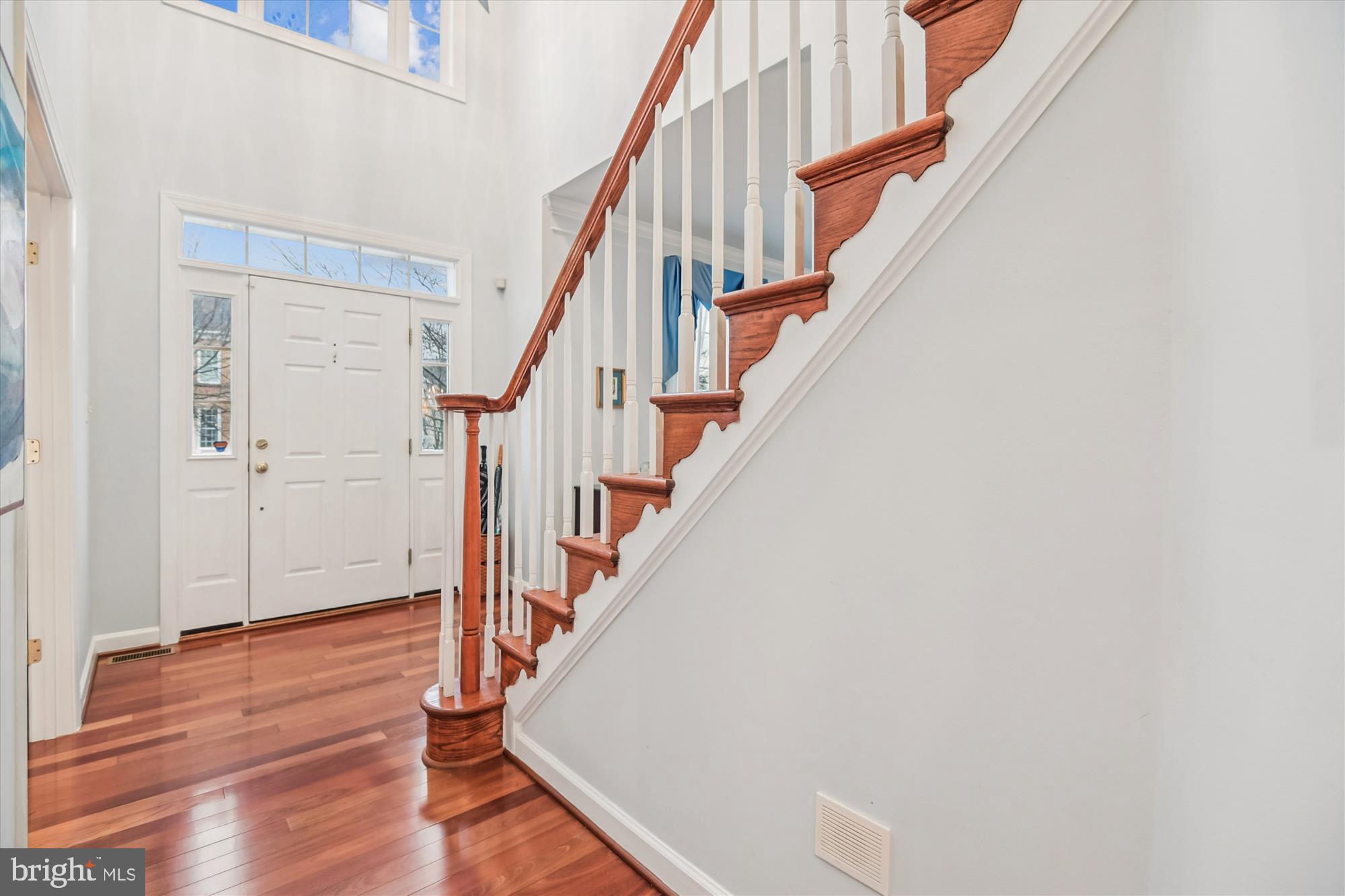 1584 Star Stella Drive Odenton, MD 21113 - Photo 4 of 45 a view of staircase with wooden floor and white walls