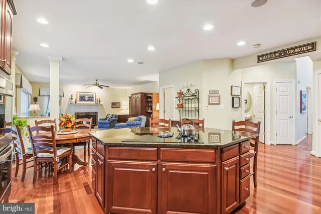 a large kitchen with a table and chairs