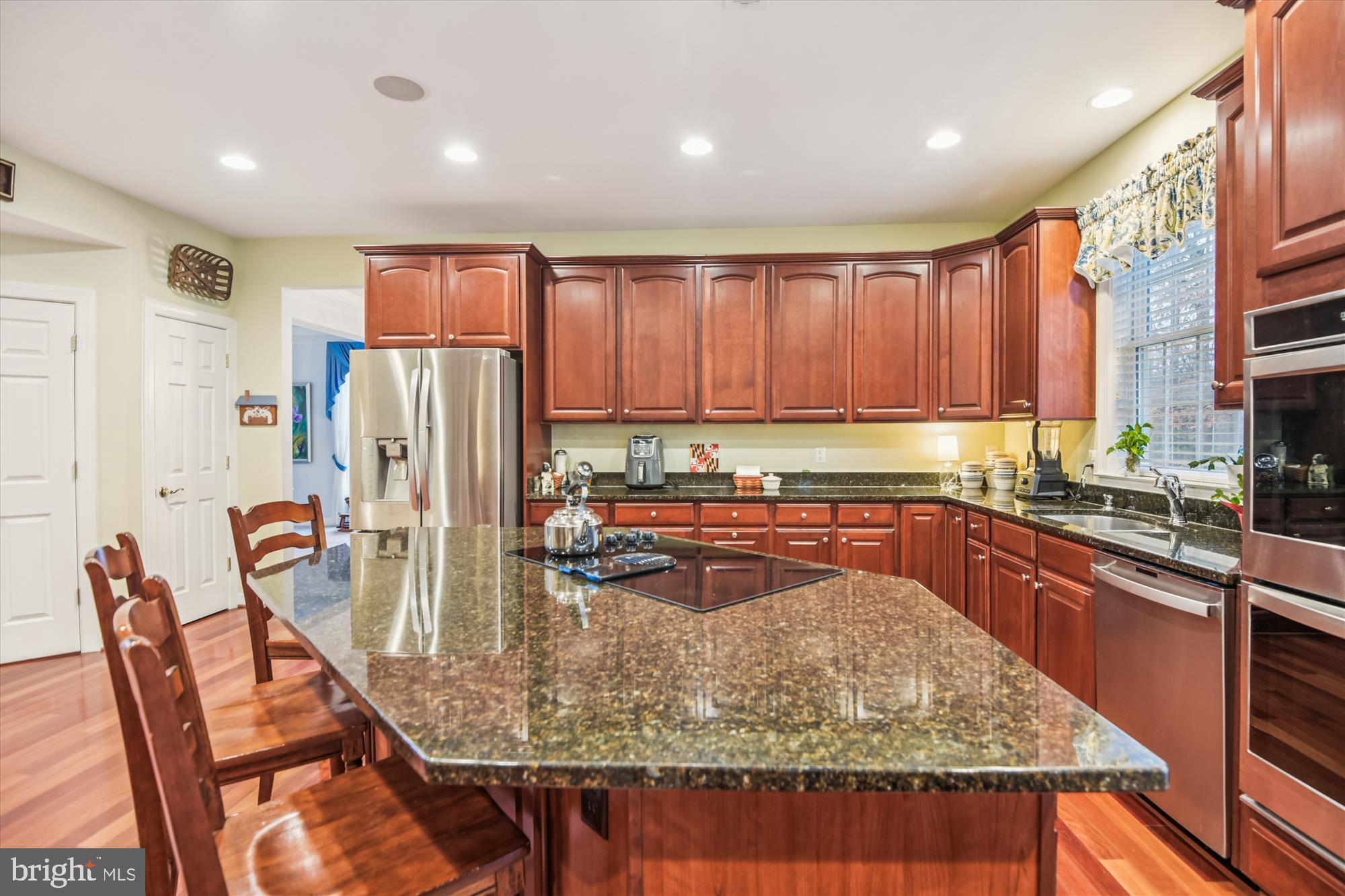 1584 Star Stella Drive Odenton, MD 21113 - Photo 9 of 45 a kitchen with stainless steel appliances granite countertop sink refrigerator and microwave