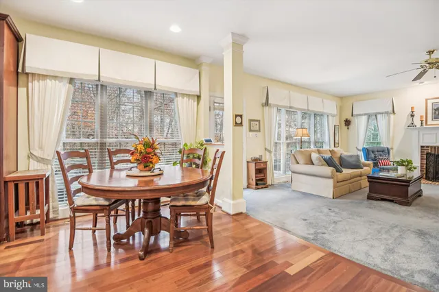 a dining room with furniture and a book shelf