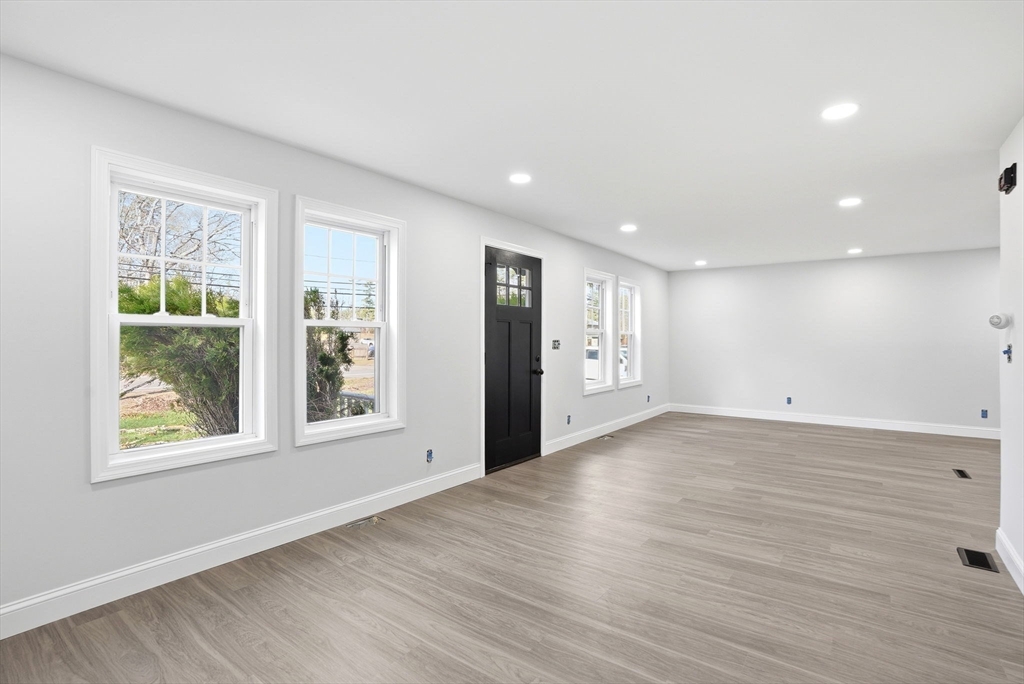 357 Wareham Street Middleboro, MA 02346 - Photo 14 of 42 an empty room with wooden floor and windows