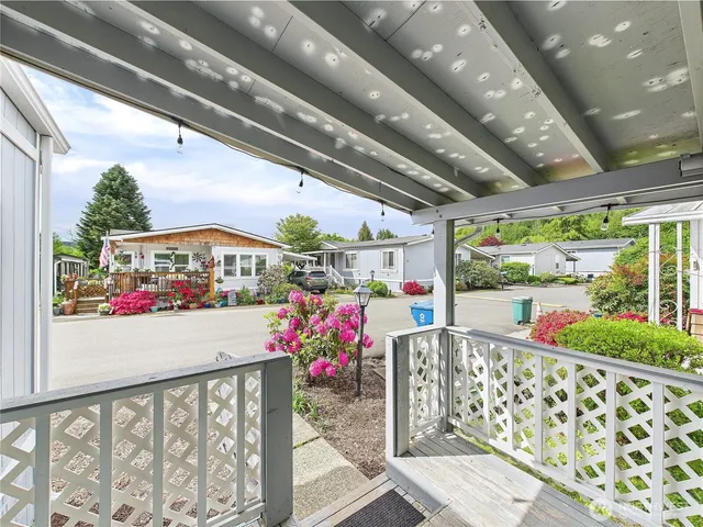 a spacious bedroom with a large bed and a large window