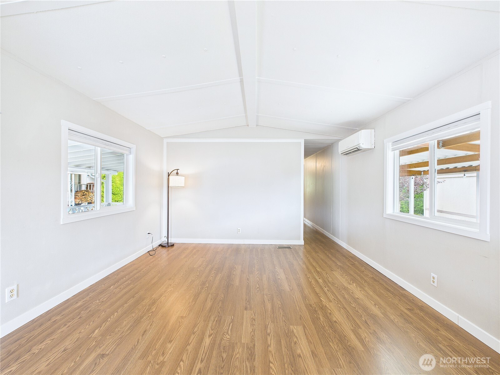 212 Old Owen Road, Unit 43 Sultan, WA 98294 - Photo 9 of 22 wooden floor in an empty room with a window