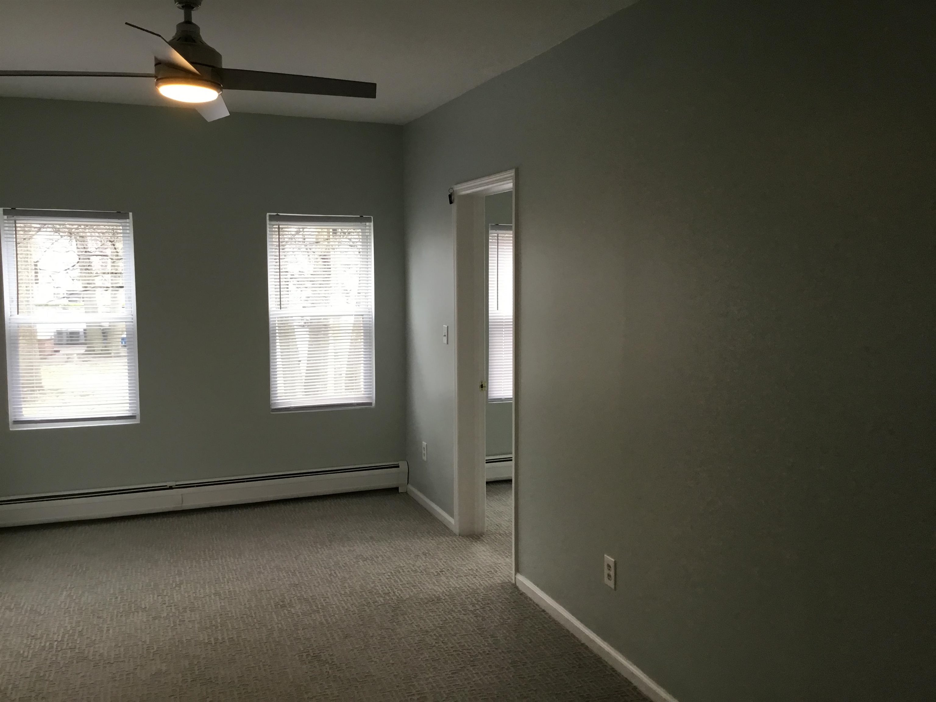 90 Union Avenue, Unit 2 Little Ferry, NJ 07643 - Photo 13 of 25 an empty room with a empty space and windows