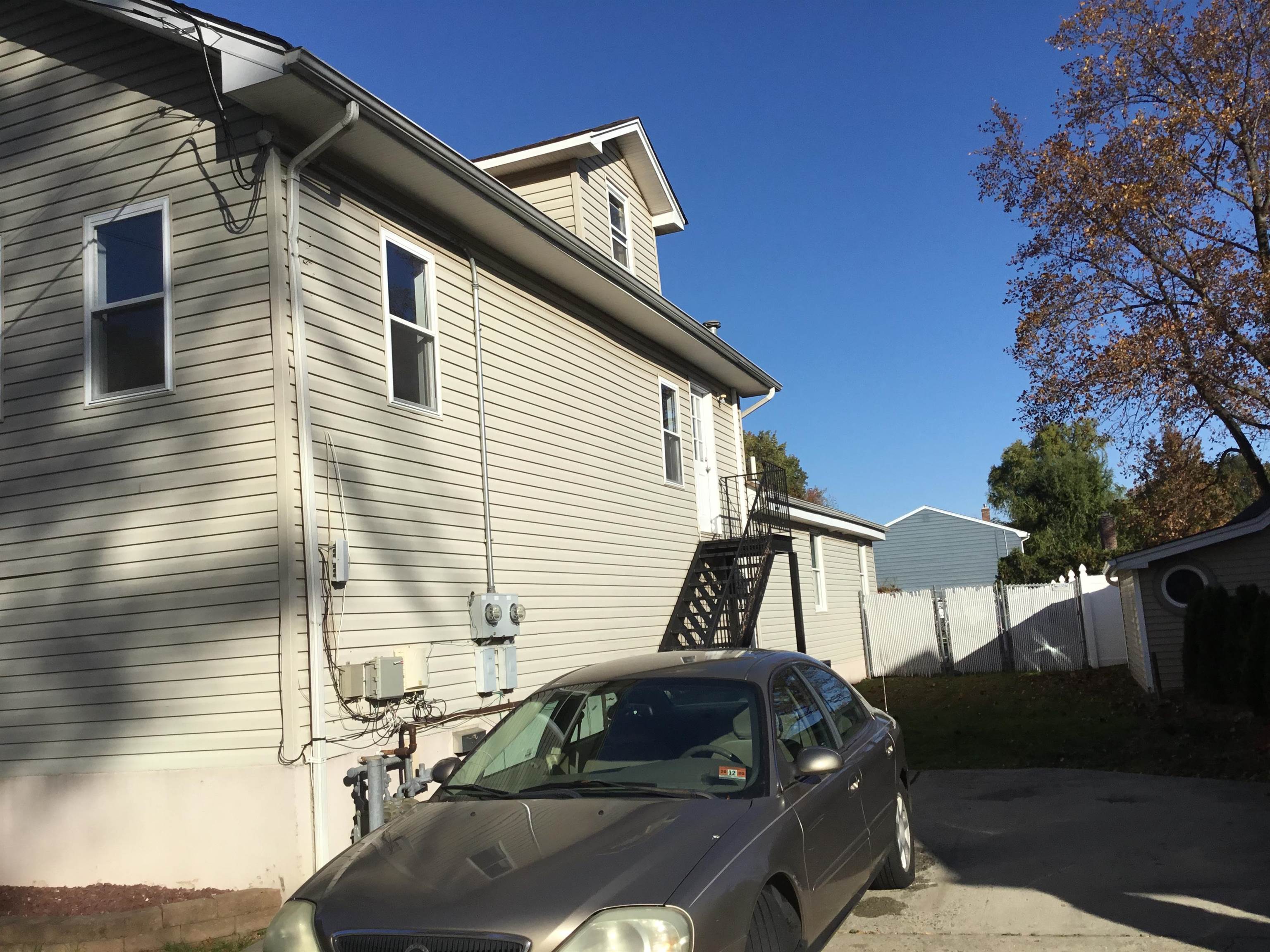 90 Union Avenue, Unit 2 Little Ferry, NJ 07643 - Photo 2 of 25 a view of a house with a yard