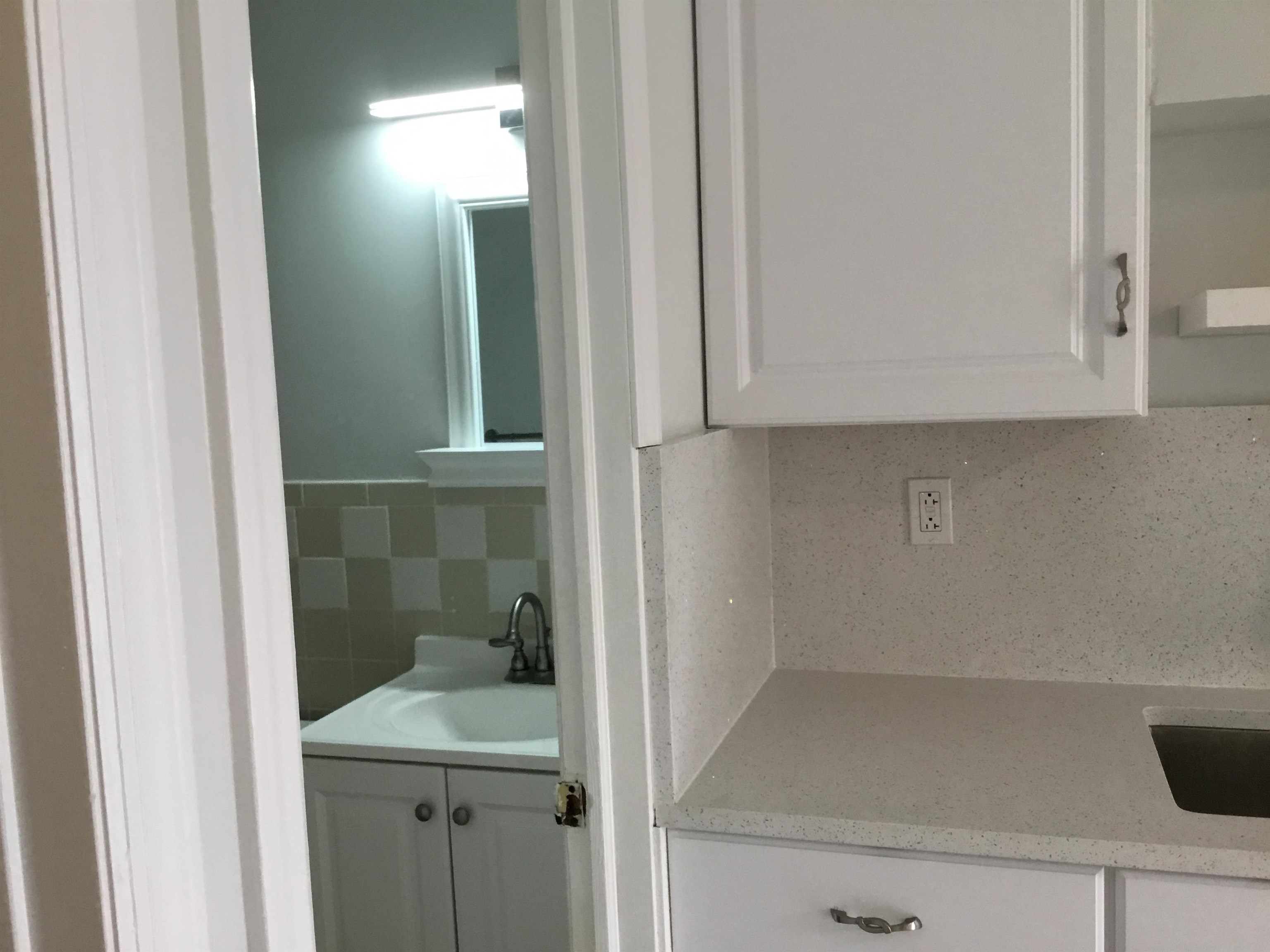90 Union Avenue, Unit 2 Little Ferry, NJ 07643 - Photo 9 of 25 a bathroom with a sink and a mirror