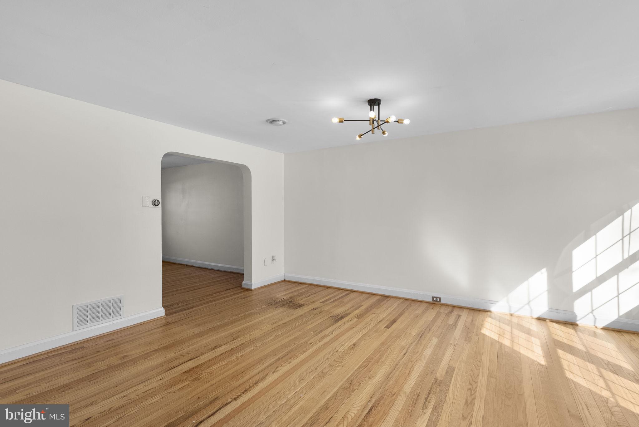 8204 Pleasant Plains Road Towson, MD 21286 - Photo 5 of 40 wooden floor in an empty room with a window