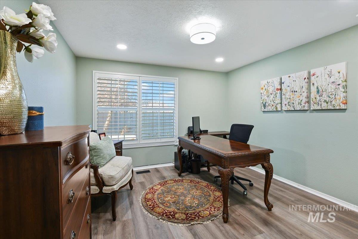 1981 North Interlachen Way Meridian, ID 83646 - Photo 13 of 24 Home office with a textured ceiling, wood finished floors, and recessed lighting
