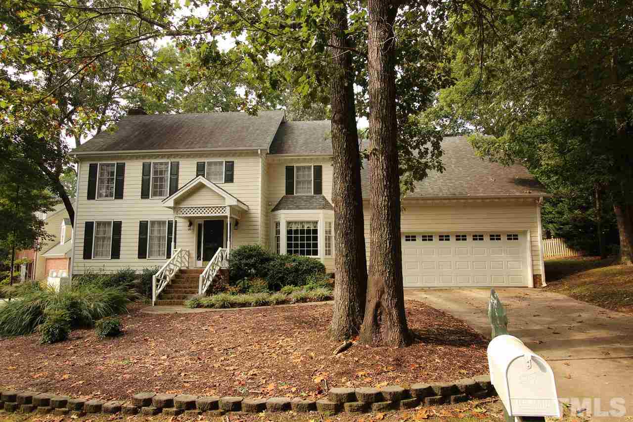 8317 Apple Orchard Way Raleigh, NC 27615 - Photo 1 of 12 a front view of a house with garden