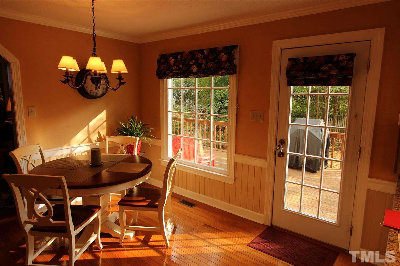 8317 Apple Orchard Way Raleigh, NC 27615 - Photo 5 of 12 a dining room with furniture and window