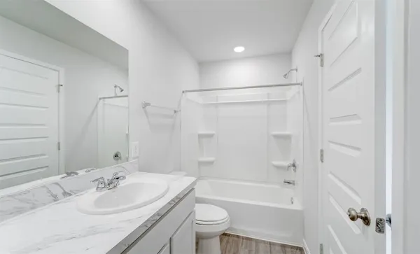 a bathroom with a sink toilet tub and shower