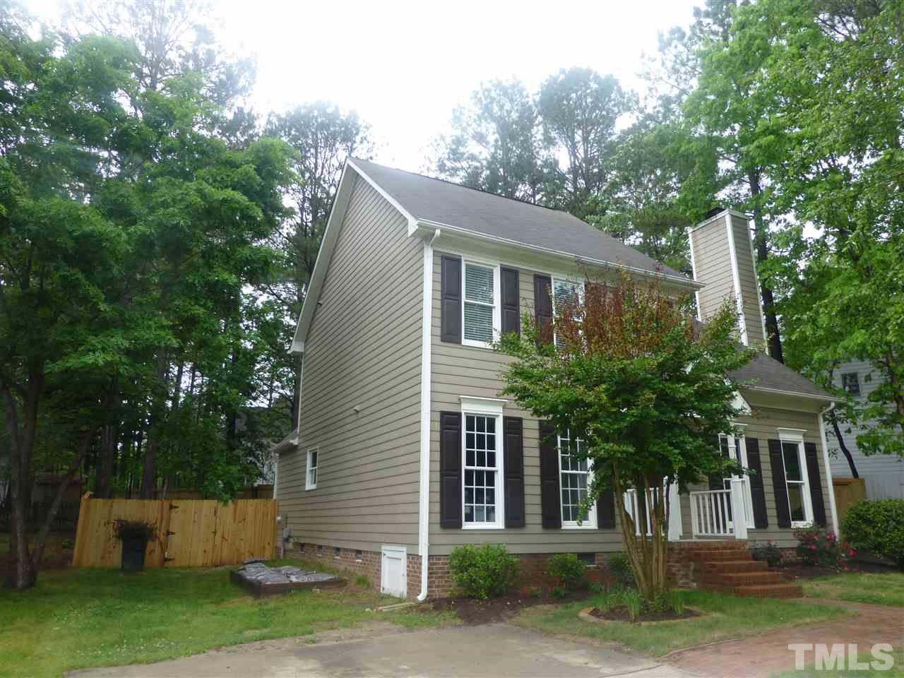 3612 Epperly Court Raleigh, NC 27616 - Photo 2 of 25 a front view of a house with a yard and a garage
