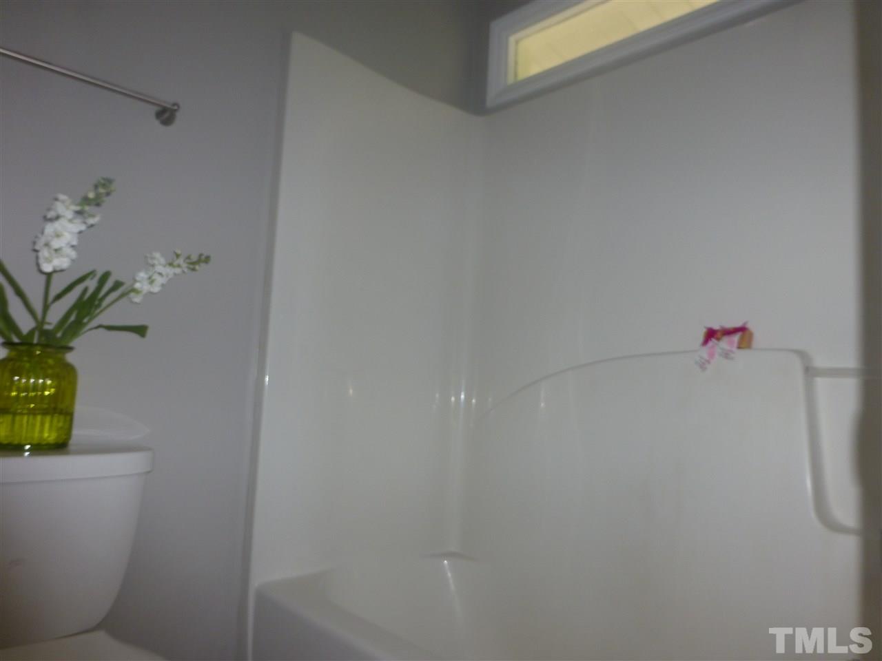 3612 Epperly Court Raleigh, NC 27616 - Photo 12 of 25 a bathroom with a shower