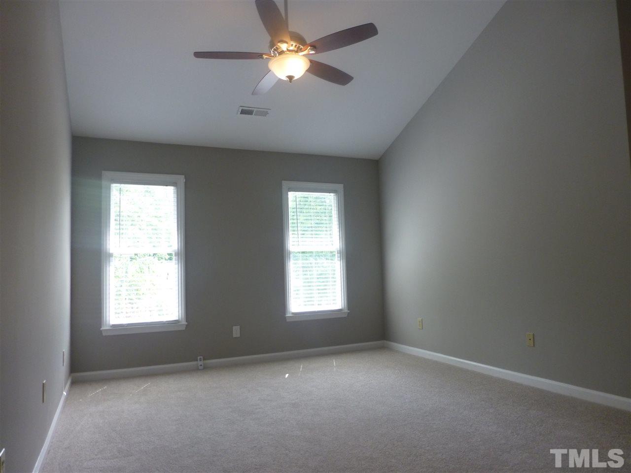 3612 Epperly Court Raleigh, NC 27616 - Photo 17 of 25 an empty room with a window and a fan