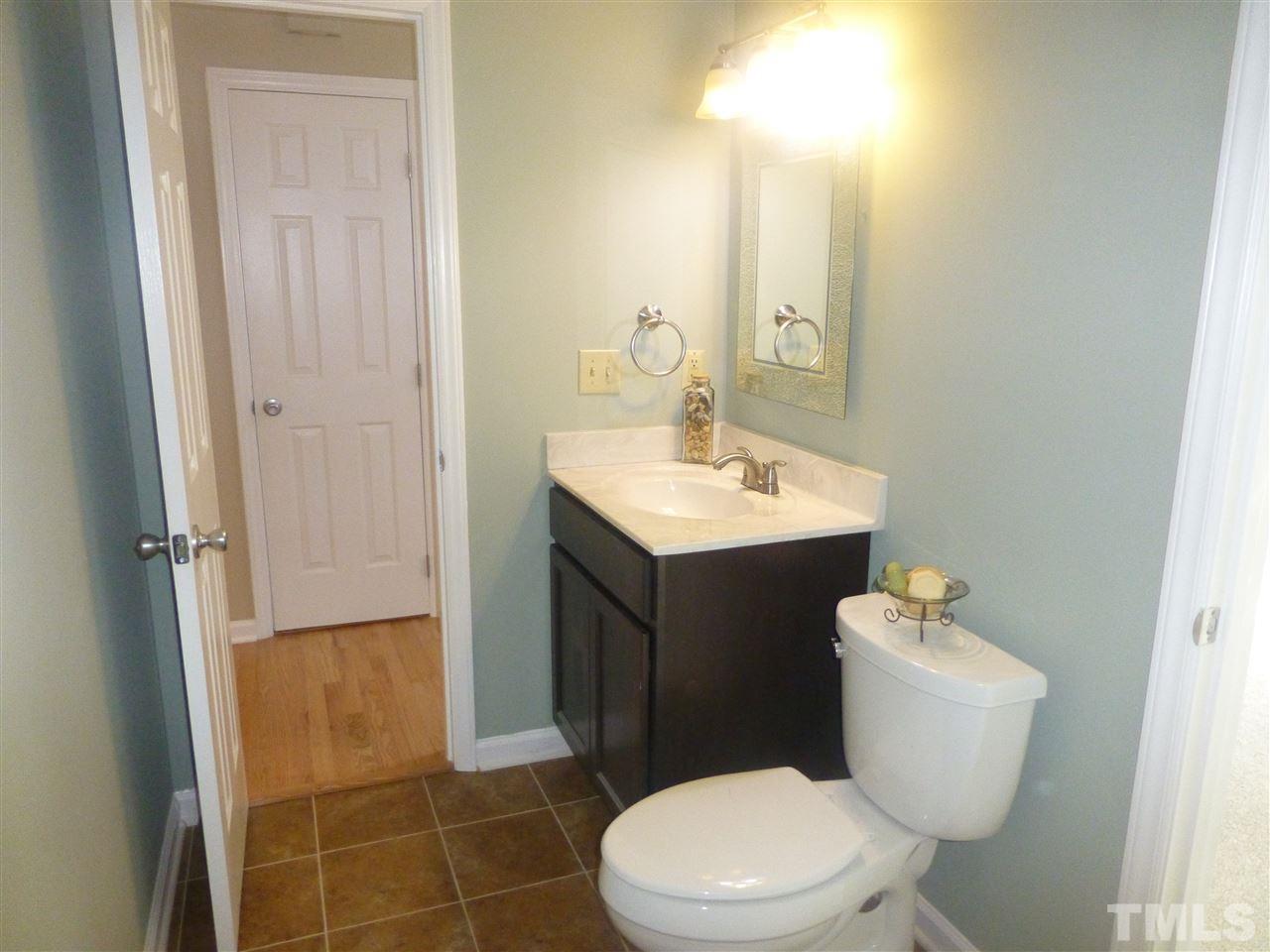 3612 Epperly Court Raleigh, NC 27616 - Photo 19 of 25 a bathroom with a toilet sink and mirror