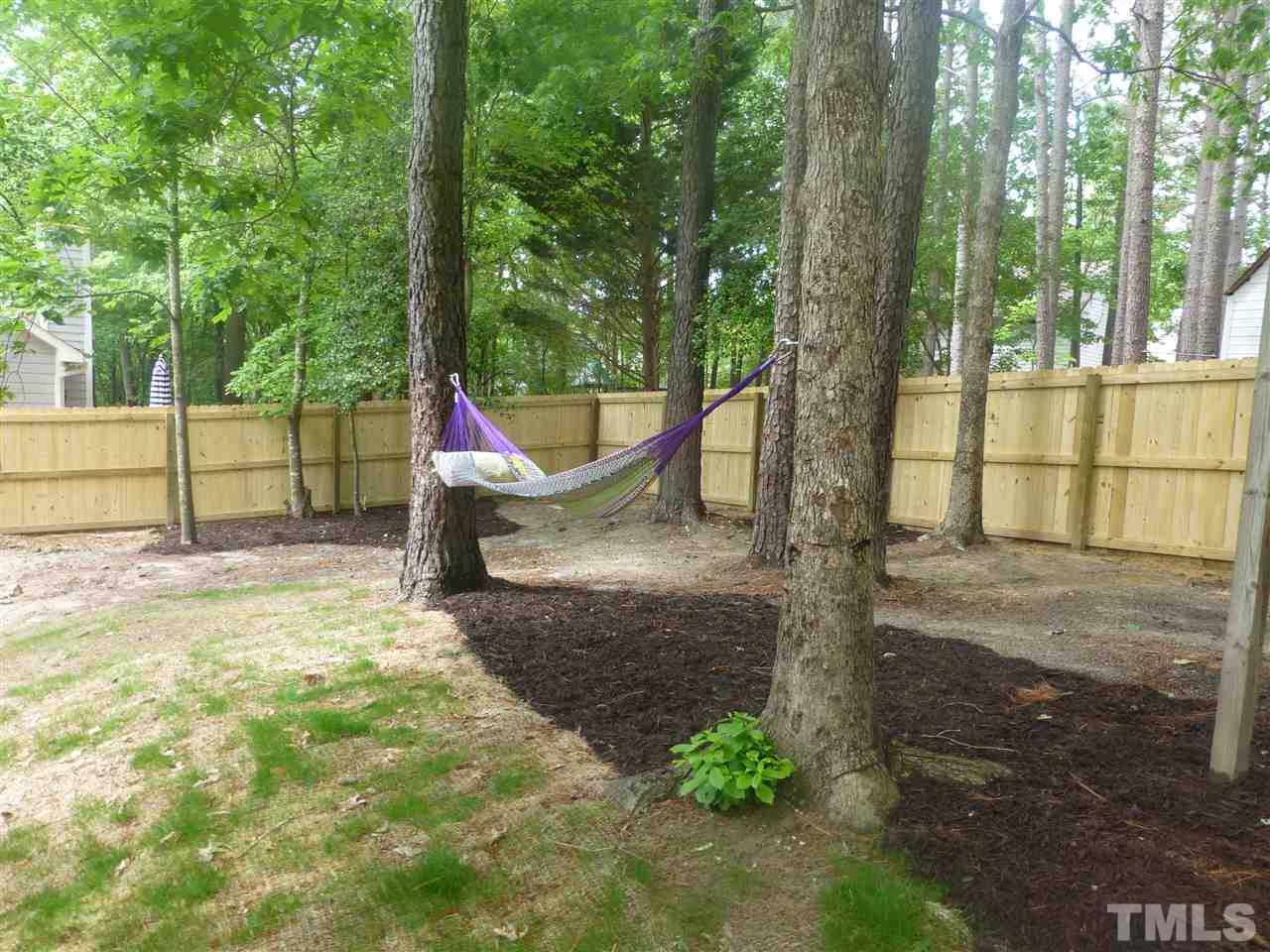 3612 Epperly Court Raleigh, NC 27616 - Photo 24 of 25 a view of outdoor space with a garden and trees