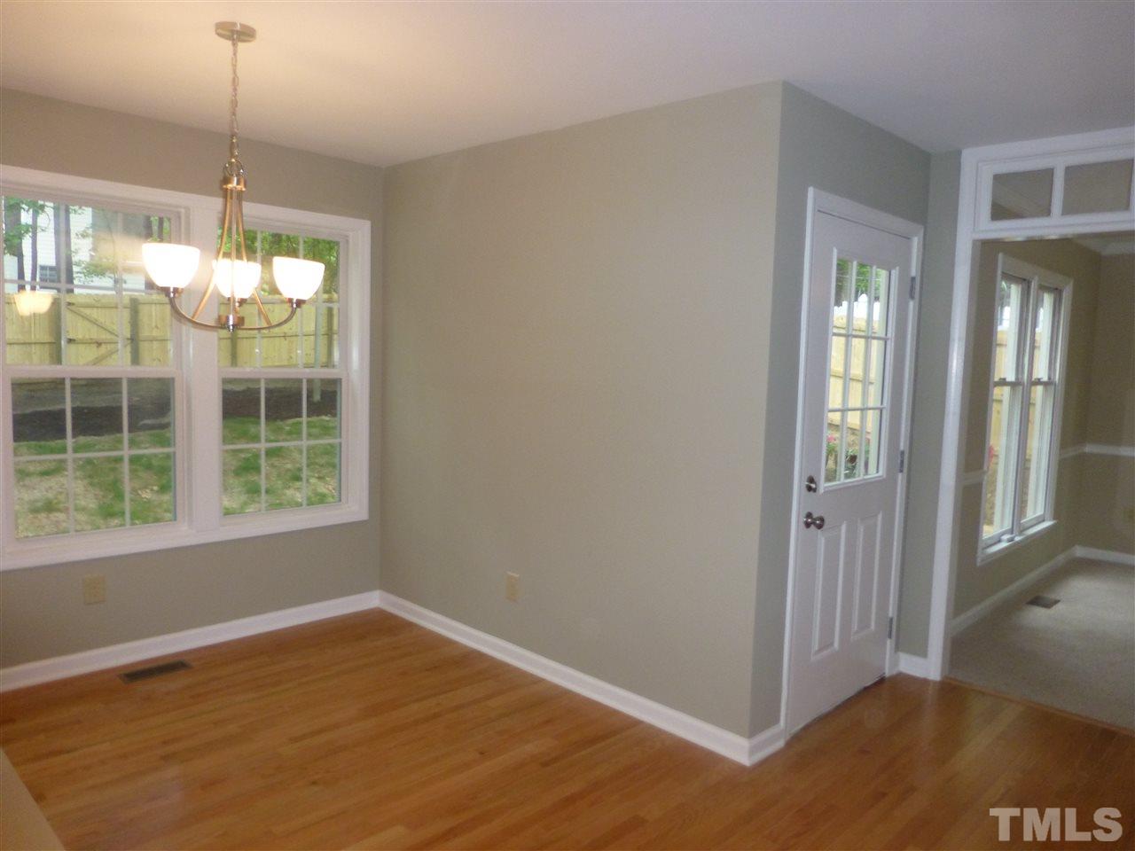 3612 Epperly Court Raleigh, NC 27616 - Photo 9 of 25 a view of an empty room with wooden floor and a window