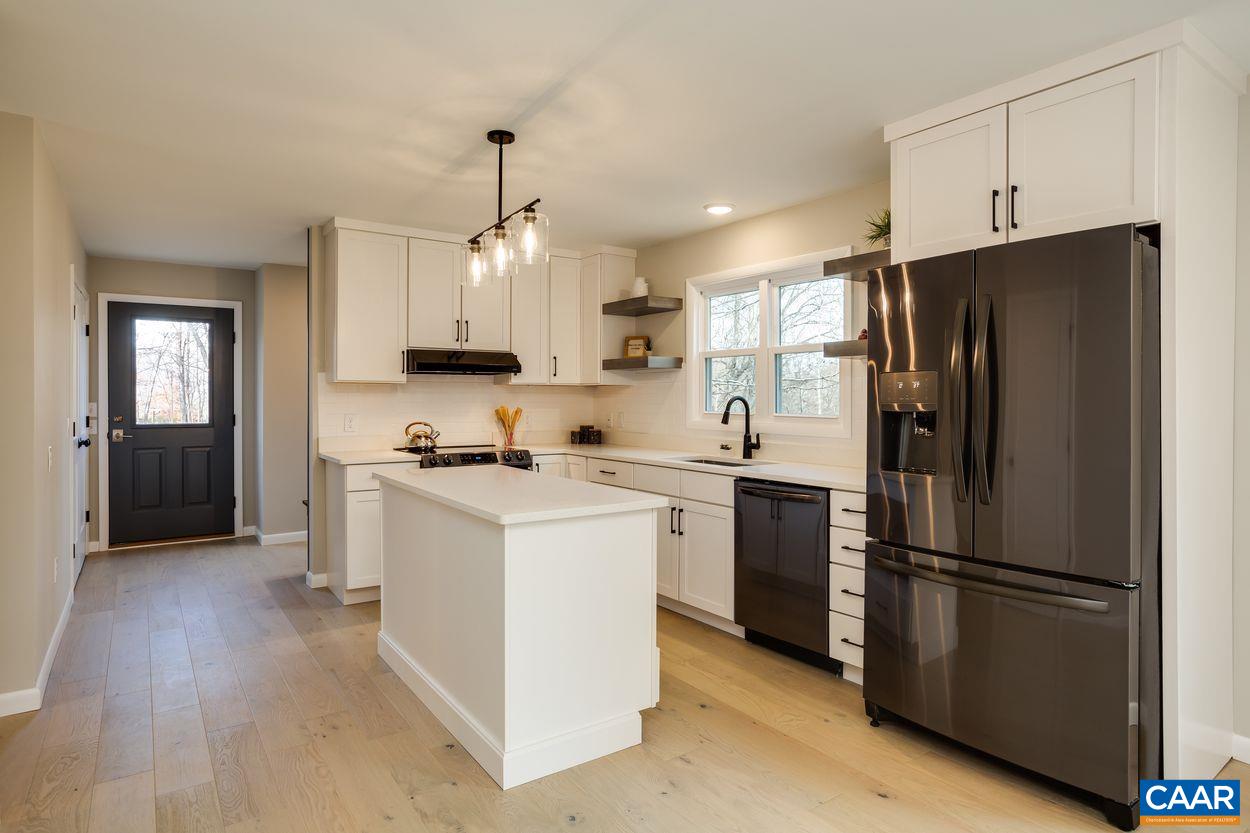 321 Gillums Ridge Road Charlottesville, VA 22903 - Photo 16 of 61 a kitchen with stainless steel appliances a refrigerator sink and microwave