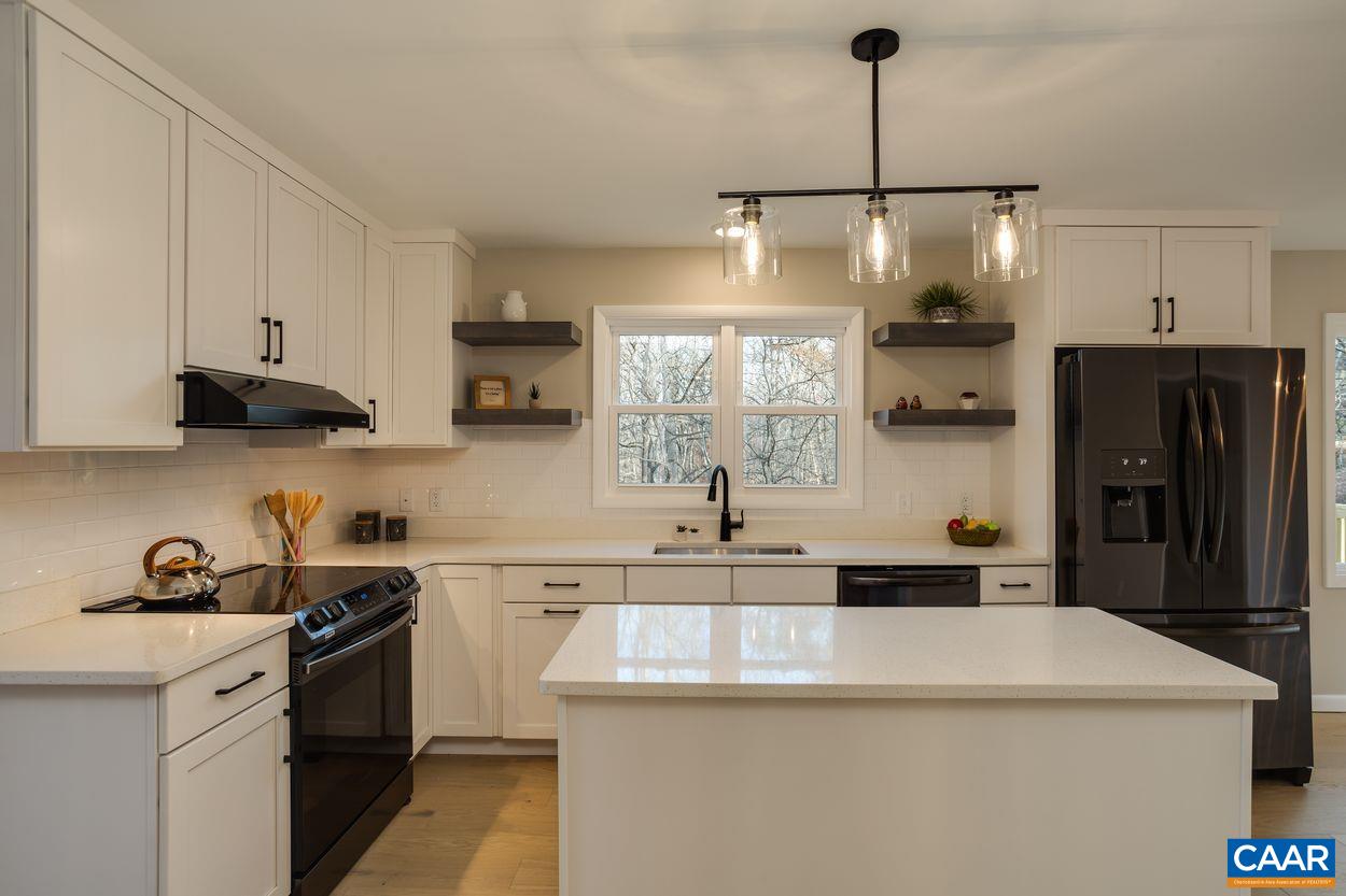 321 Gillums Ridge Road Charlottesville, VA 22903 - Photo 17 of 61 a kitchen with stainless steel appliances a sink stove and refrigerator