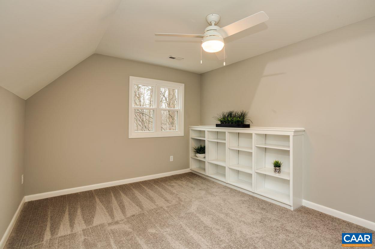 321 Gillums Ridge Road Charlottesville, VA 22903 - Photo 38 of 61 an empty room with a window and cabinet