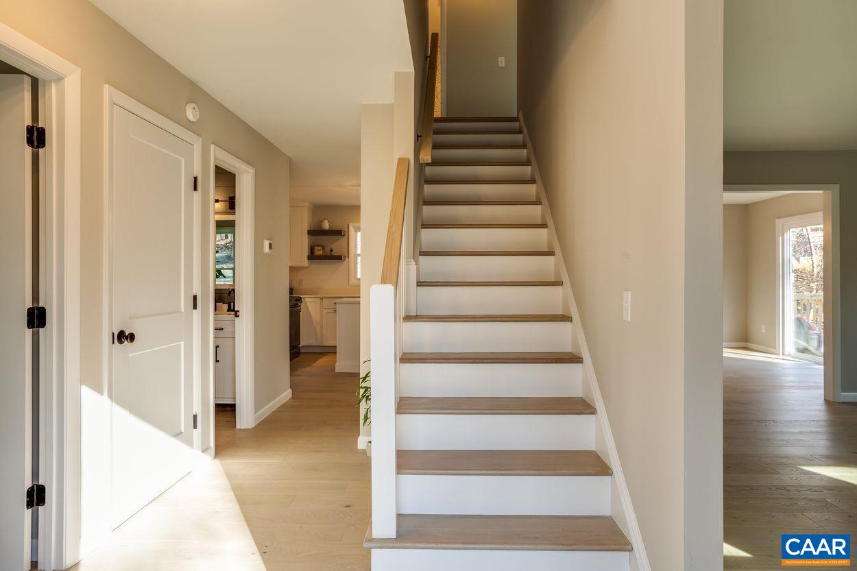 321 Gillums Ridge Road Charlottesville, VA 22903 - Photo 5 of 61 a view of a hallway with wooden floor and entryway