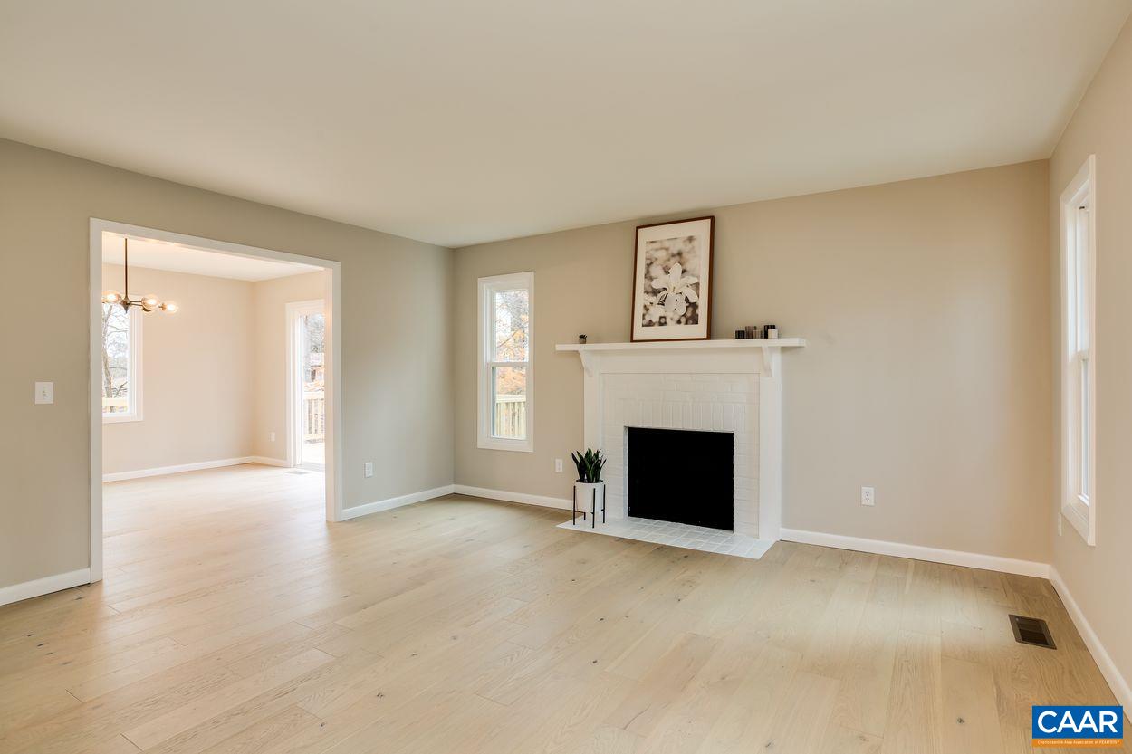321 Gillums Ridge Road Charlottesville, VA 22903 - Photo 8 of 61 a view of a livingroom with a fireplace and window