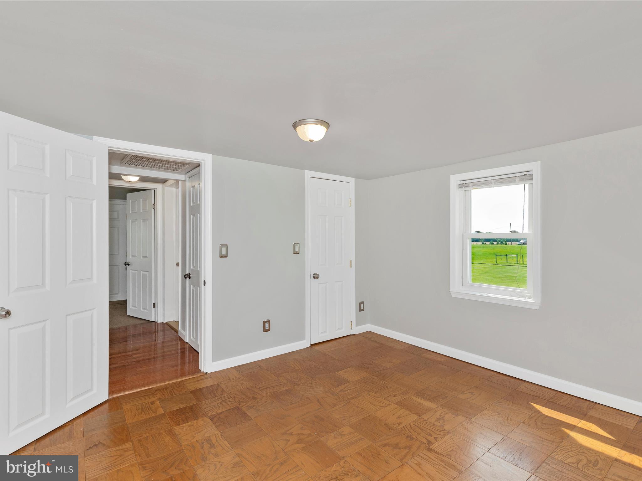 4215 Harney Road Taneytown, MD 21787 - Photo 27 of 46 a view of an empty room with window and closet area