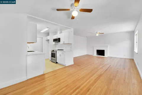 a view of kitchen with wooden floor