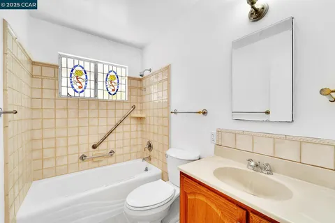 a bathroom with a sink a toilet and bathtub