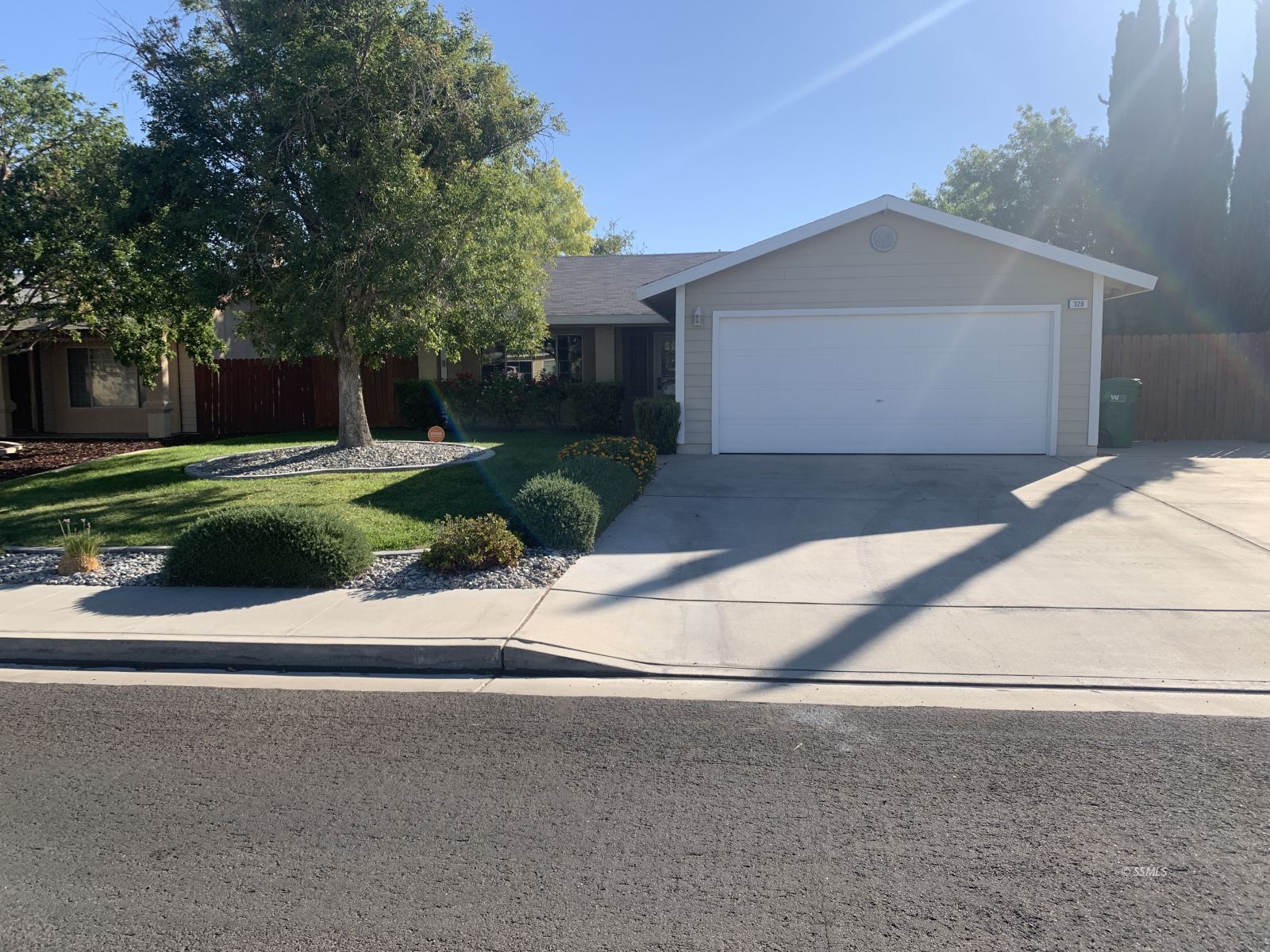 328 Ashton Street Ridgecrest, CA 93555 - Photo 27 of 28 a white house with a outdoor space