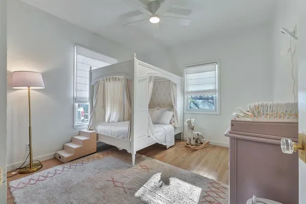 a room with a mirror and furniture