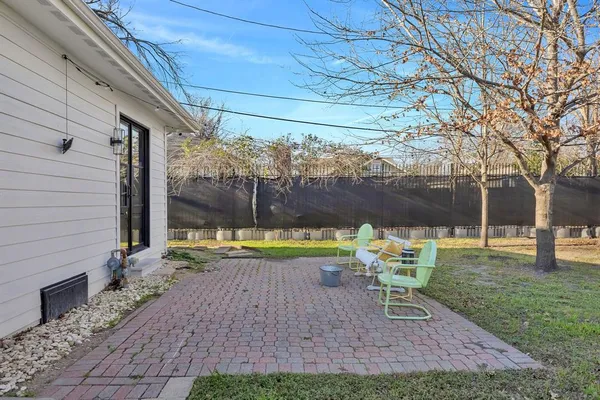 a view of backyard with sitting area