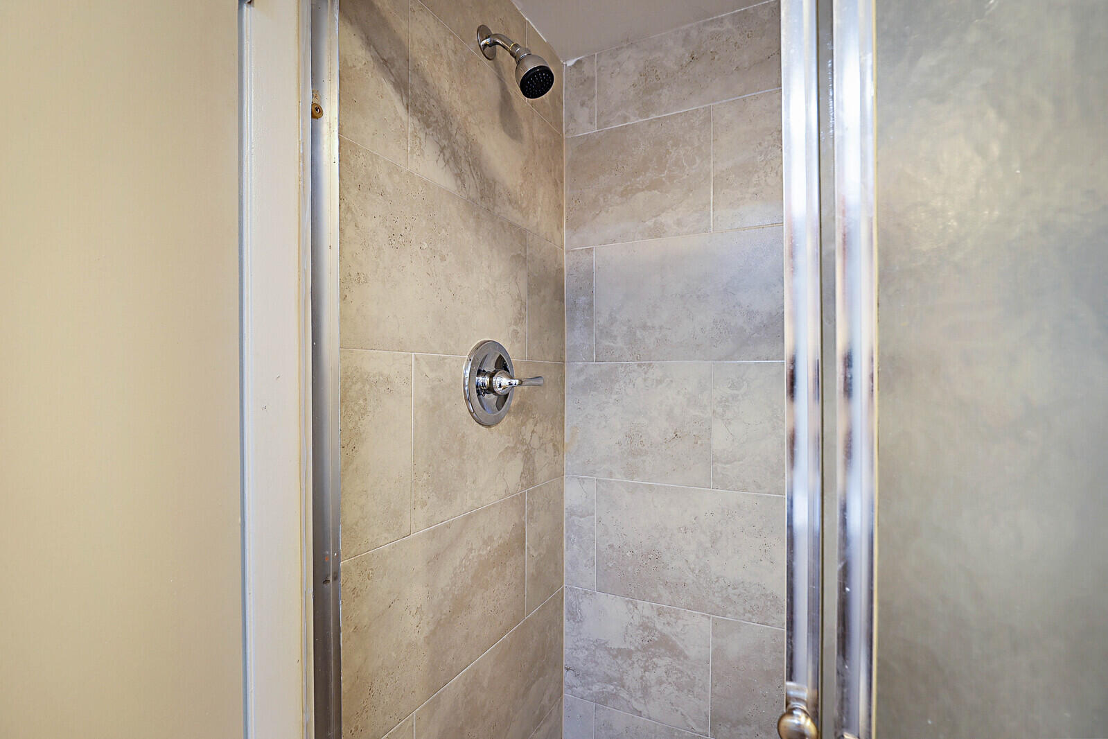 253 Woodland Road Palm Springs, FL 33461 - Photo 16 of 27 a bathroom with a shower