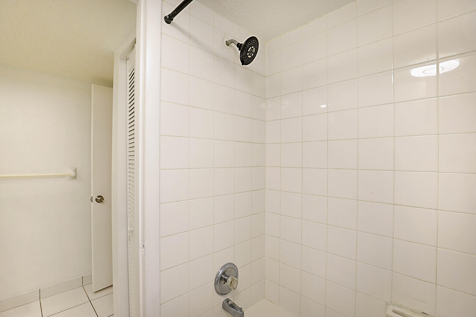 253 Woodland Road Palm Springs, FL 33461 - Photo 24 of 27 a bathroom with a shower