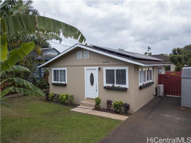 66-345 Kaamooloa Road, Unit F Waialua, HI 96791 - Photo 1 of 1 a front view of house with yard and green space