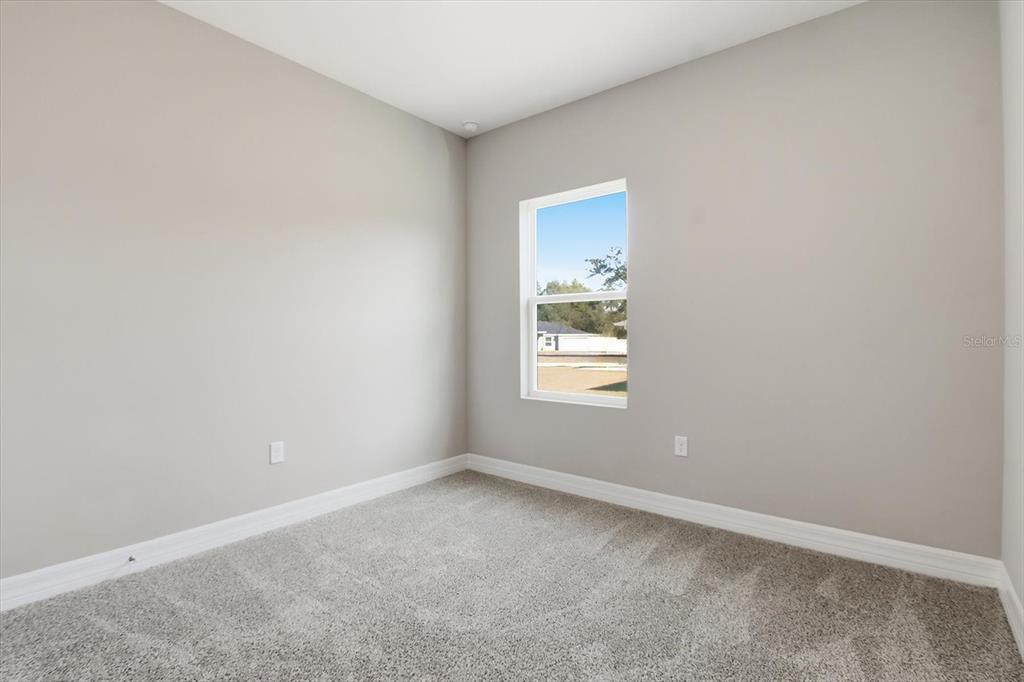 16604 Southwest 21st Circle Ocala, FL 34473 - Photo 28 of 43 an empty room with a window