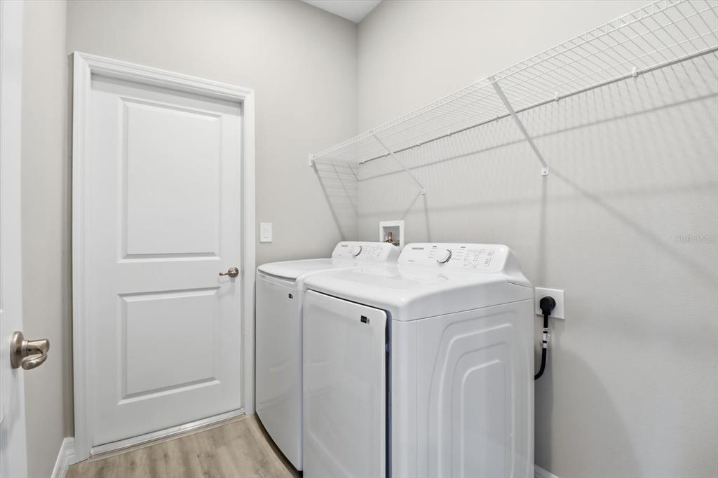 16604 Southwest 21st Circle Ocala, FL 34473 - Photo 30 of 43 a utility room with dryer and washer