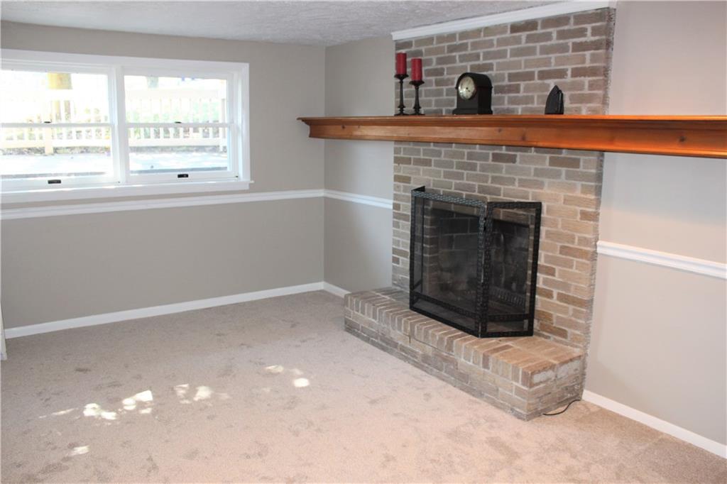 111 Cross Monaca, PA 15061 - Photo 18 of 24 Lower Level Family Room with Wood Burning Fireplace